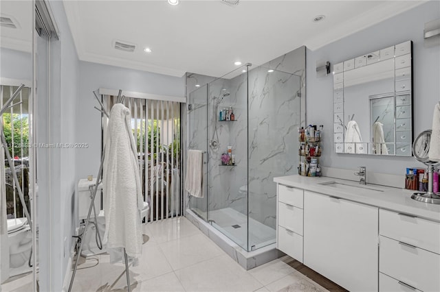 bathroom featuring a shower with shower door, toilet, vanity, and ornamental molding