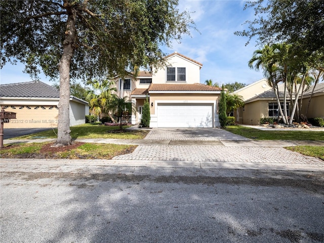 view of front of property with a garage