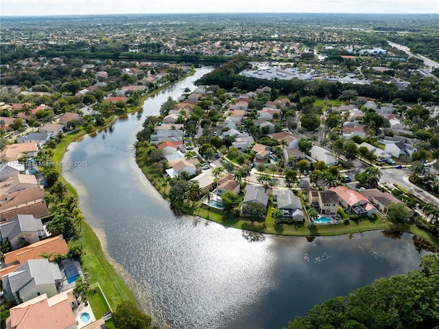 bird's eye view with a water view