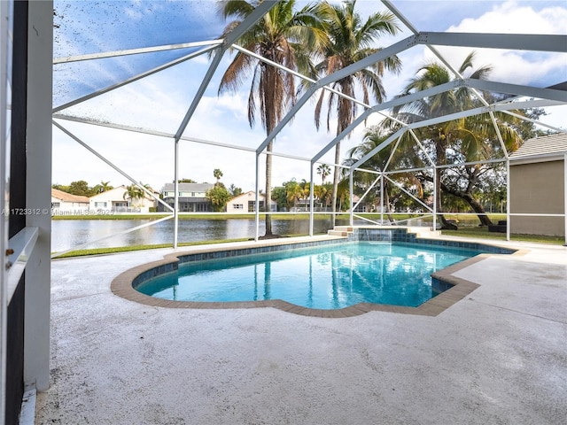 view of swimming pool with a water view, a patio area, and a lanai