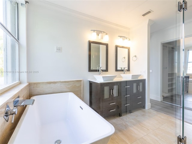 bathroom with vanity, independent shower and bath, and ornamental molding