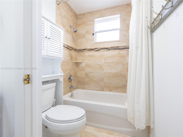 bathroom featuring toilet and shower / bath combo with shower curtain