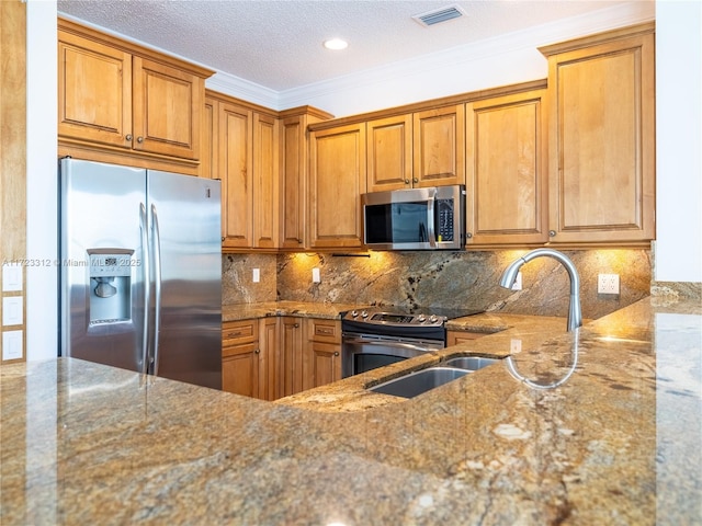 kitchen with tasteful backsplash, appliances with stainless steel finishes, and light stone counters