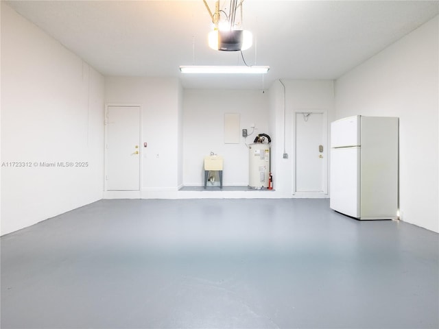 garage with sink, electric water heater, white refrigerator, and a garage door opener