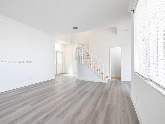 unfurnished room with light hardwood / wood-style floors