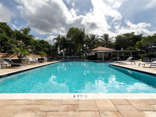 view of swimming pool with a patio area