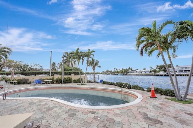 view of pool with a water view