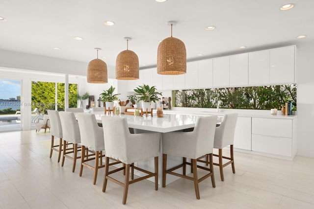 1065 N Shore Dr, Miami Beach, FL 33141 - dining room with recessed lighting and light wood-style flooring