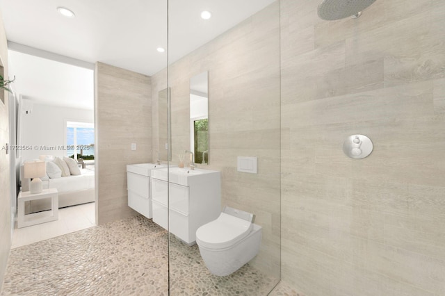 1065 N Shore Dr, Miami Beach, FL 33141 - bathroom featuring tile walls, ensuite bathroom, walk in shower, toilet, and vanity
