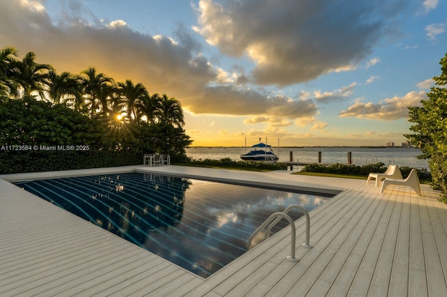 1065 N Shore Dr, Miami Beach, FL 33141 - pool at dusk with an outdoor pool and a deck with water view