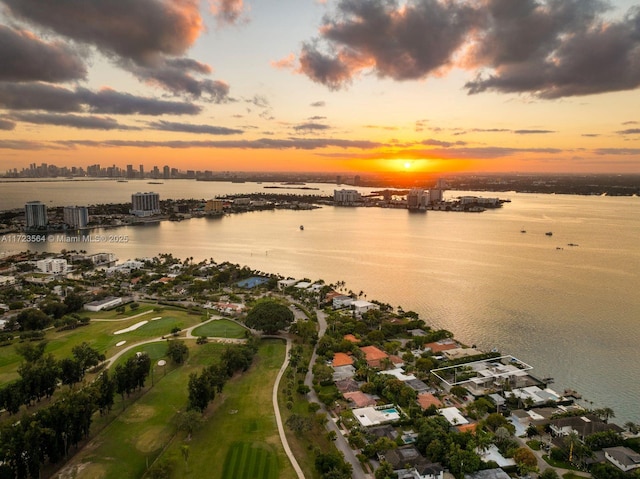 aerial view at dusk with a water view