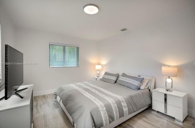 bedroom with light wood-type flooring