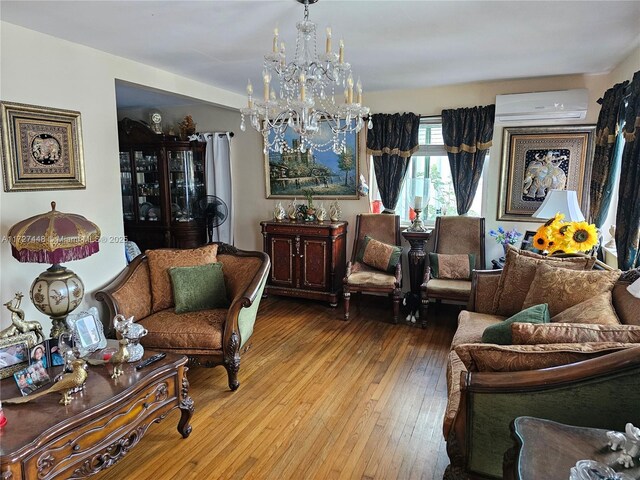 living room featuring a chandelier and hardwood / wood-style floors