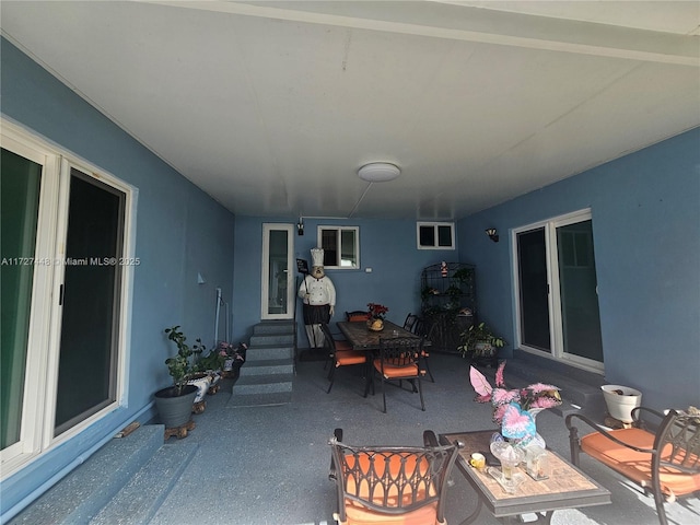 view of patio featuring entry steps and outdoor dining space