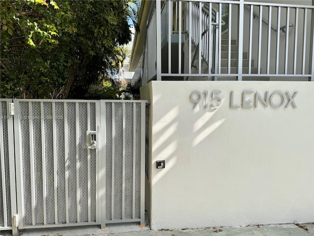 view of gate with central air condition unit