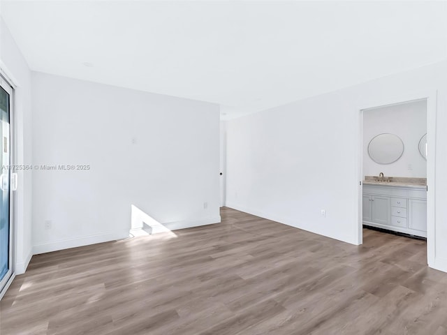 interior space featuring light hardwood / wood-style floors and sink