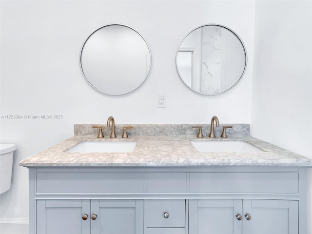 bathroom with toilet and vanity