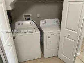 laundry area with washer and clothes dryer