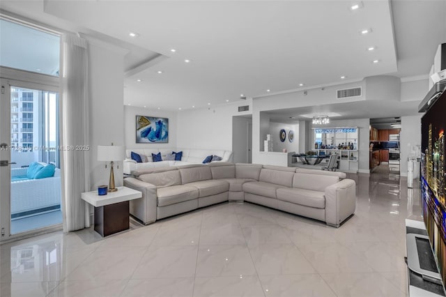 living room featuring recessed lighting and visible vents