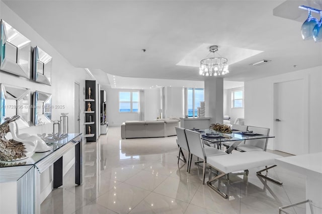 dining room with visible vents and a notable chandelier