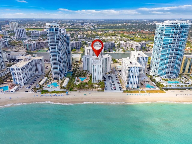 aerial view featuring a water view and a view of the beach