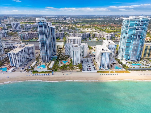 aerial view featuring a water view and a view of the beach