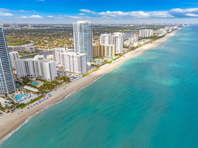 birds eye view of property with a view of city, a water view, and a view of the beach