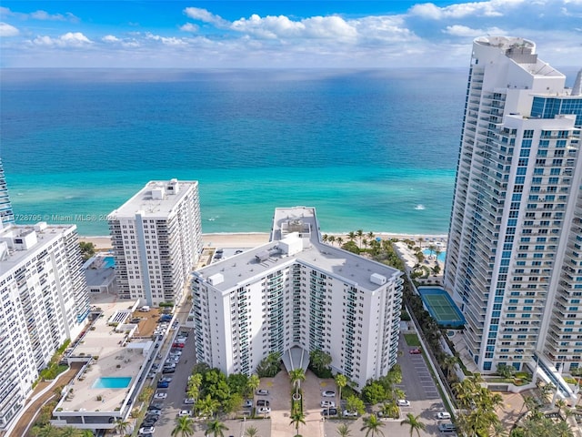 bird's eye view featuring a water view and a view of the beach