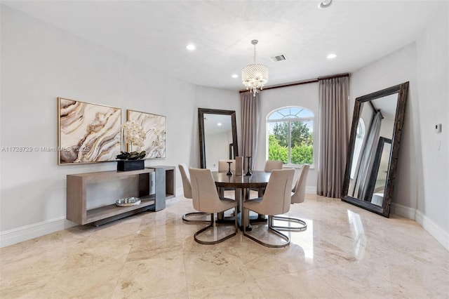 dining space featuring an inviting chandelier