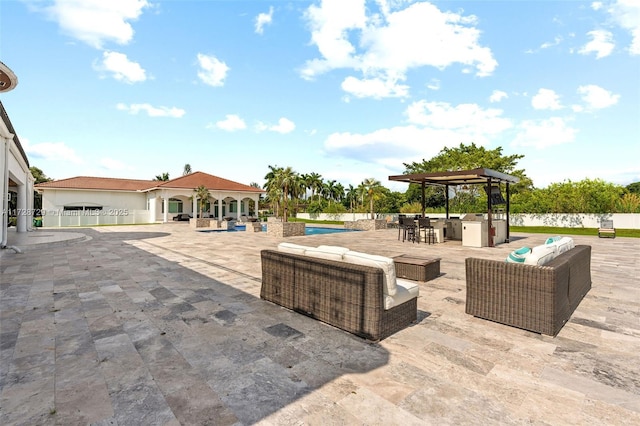 view of patio / terrace featuring exterior kitchen and outdoor lounge area