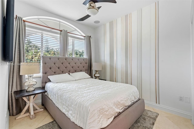 tiled bedroom with ceiling fan