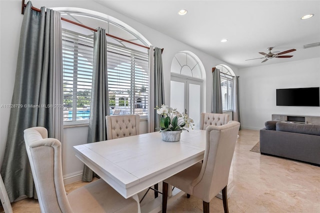 dining room featuring ceiling fan