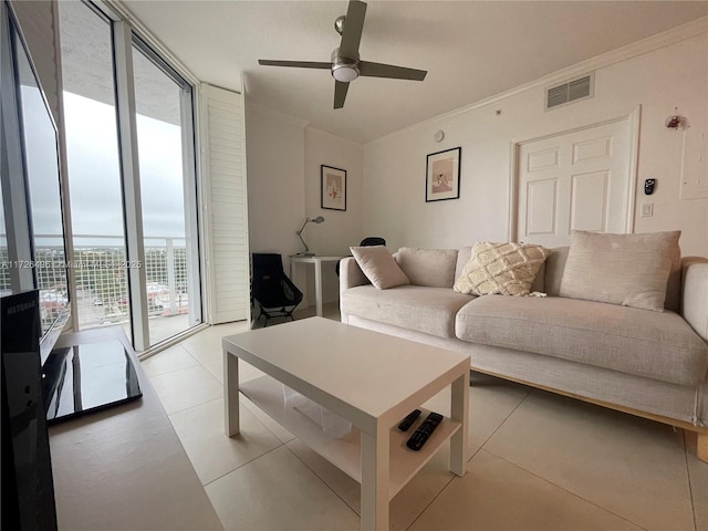 living room featuring ceiling fan, crown molding, and floor to ceiling windows