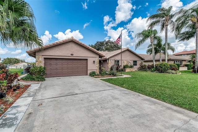 ranch-style house with a garage and a front yard