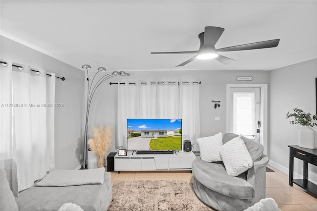 tiled living room featuring ceiling fan