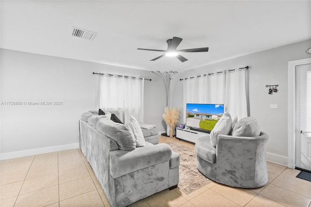 tiled living room featuring ceiling fan