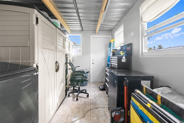 home office with light tile patterned floors