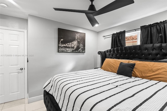 tiled bedroom with ceiling fan