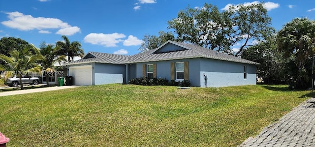 ranch-style house with a garage, a front lawn, stucco siding, and driveway