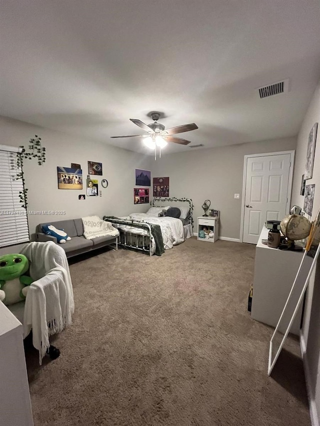 bedroom featuring ceiling fan and carpet floors