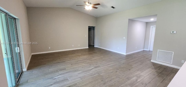 garage with water heater, a garage door opener, concrete block wall, and electric panel