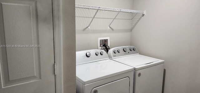 laundry room featuring washer and clothes dryer