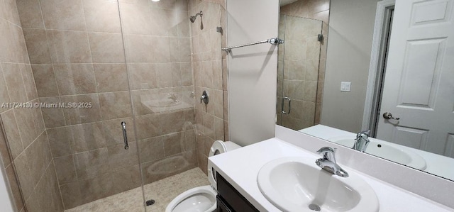 full bathroom with toilet, vanity, and a stall shower