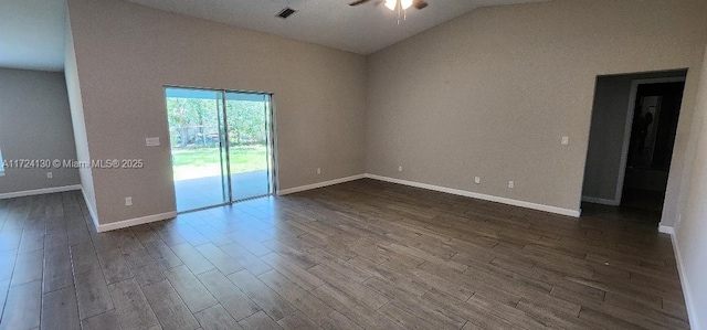 spare room with wood finished floors, lofted ceiling, a ceiling fan, and visible vents