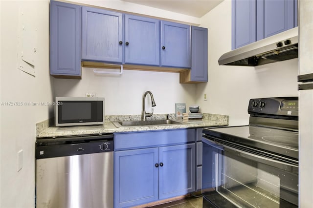 kitchen with sink, appliances with stainless steel finishes, and blue cabinets