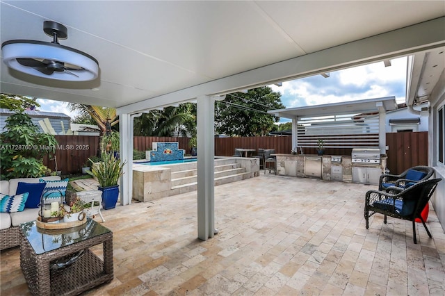 view of patio with exterior kitchen, grilling area, a pool, and ceiling fan