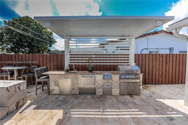 view of patio / terrace with a grill and exterior kitchen