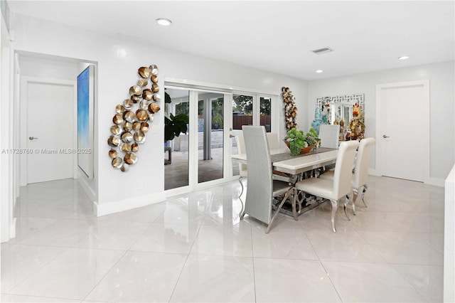 dining area featuring light tile patterned floors and french doors