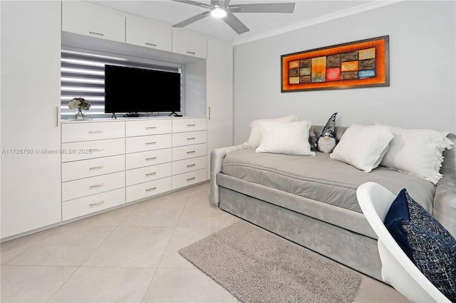 tiled bedroom featuring ornamental molding and ceiling fan