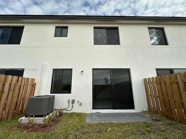 rear view of house with central AC